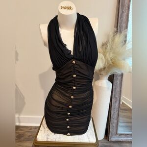 Black ruched mini dress with gold buttons